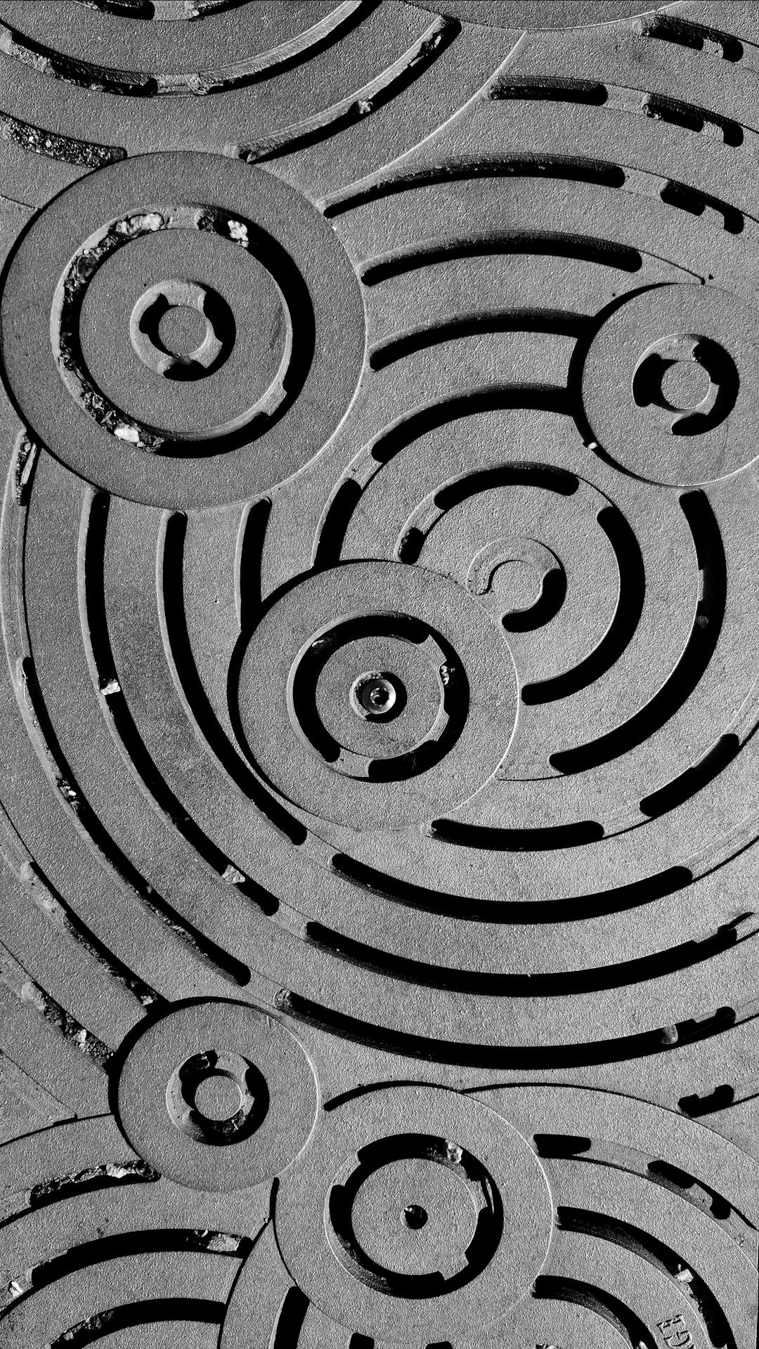 ripple effect on metal; manhole sewage cover; industrial design