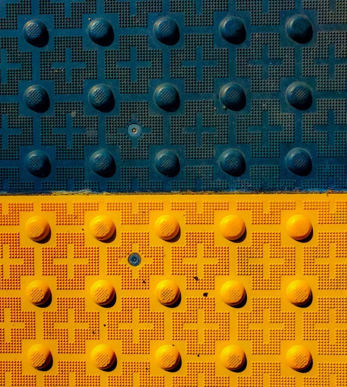 ours-journey Vibrant close-up of textured blue and yellow cross motifs, perfect for backgrounds.
